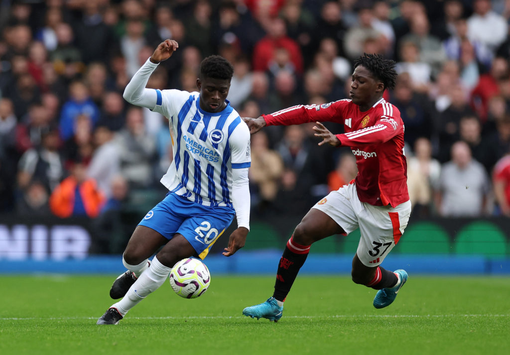 Kobbie Mainoo chases Carlos Baleba during Manchester United vs Brighton.