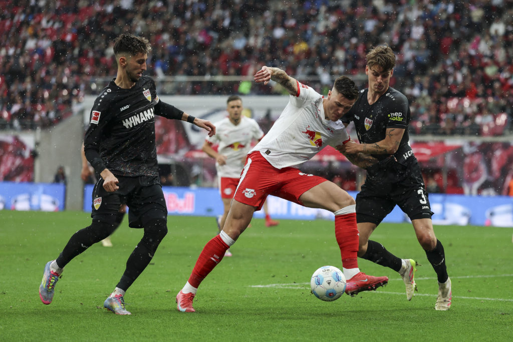Benjamin Sesko of RB Leipzig battles for possession with Ramon Hendriks of VfB Stuttgart during the Bundesliga match between RB Leipzig and VfB Stuttgart at Red Bull Arena on May 17, 2025