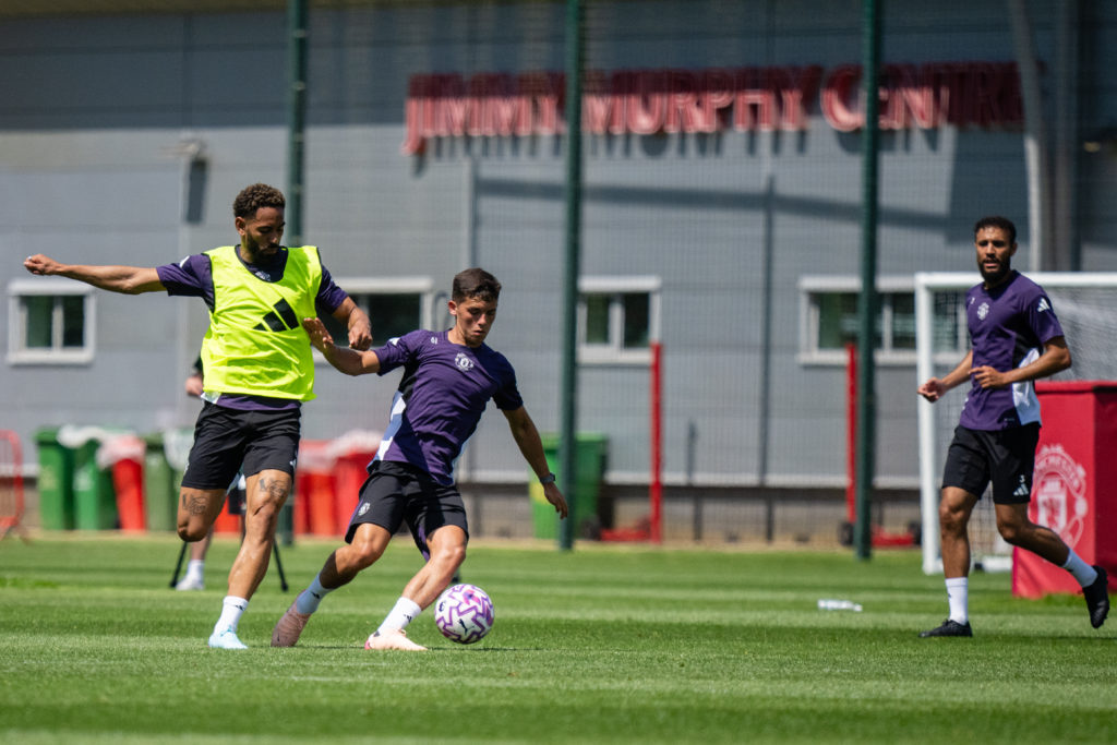 Shea Lacey dribbles the ball in training against Matheus Cunha