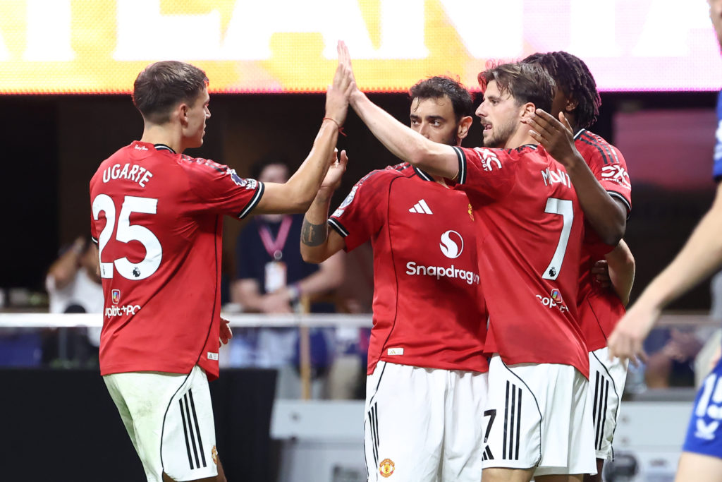 Manchester United midfielder Mason Mount (7) gets hugs after his goal.