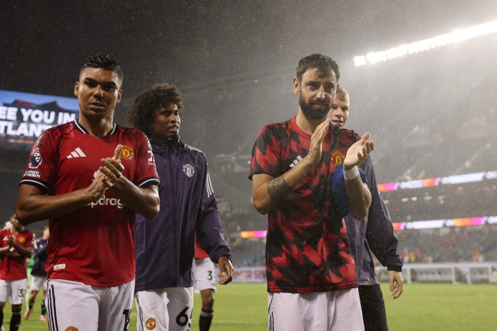 Casemiro and Bruno Fernandes applaud Manchester United fans in Chicago.