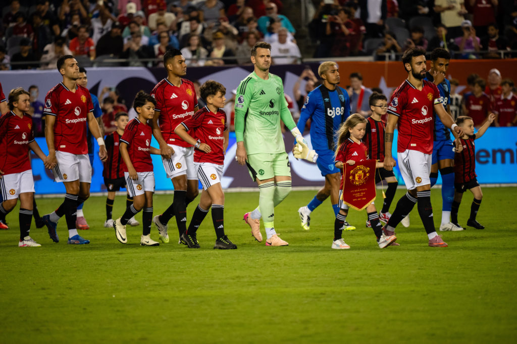 Tom Heaton, Casemiro, Diogo Dalot and Harry Maguire of Manchester United walk out ahead of the Premier League Summer Series match between Manchester United and AFC Bournemouth at Soldier Field on July 30, 2025
