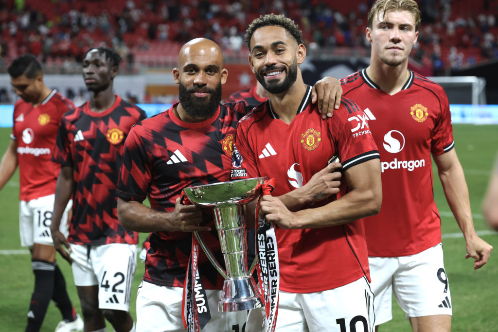 Manchester United duo Bryan Mbeumo and Matheus Cunha pose with the Premier League Summer Series.