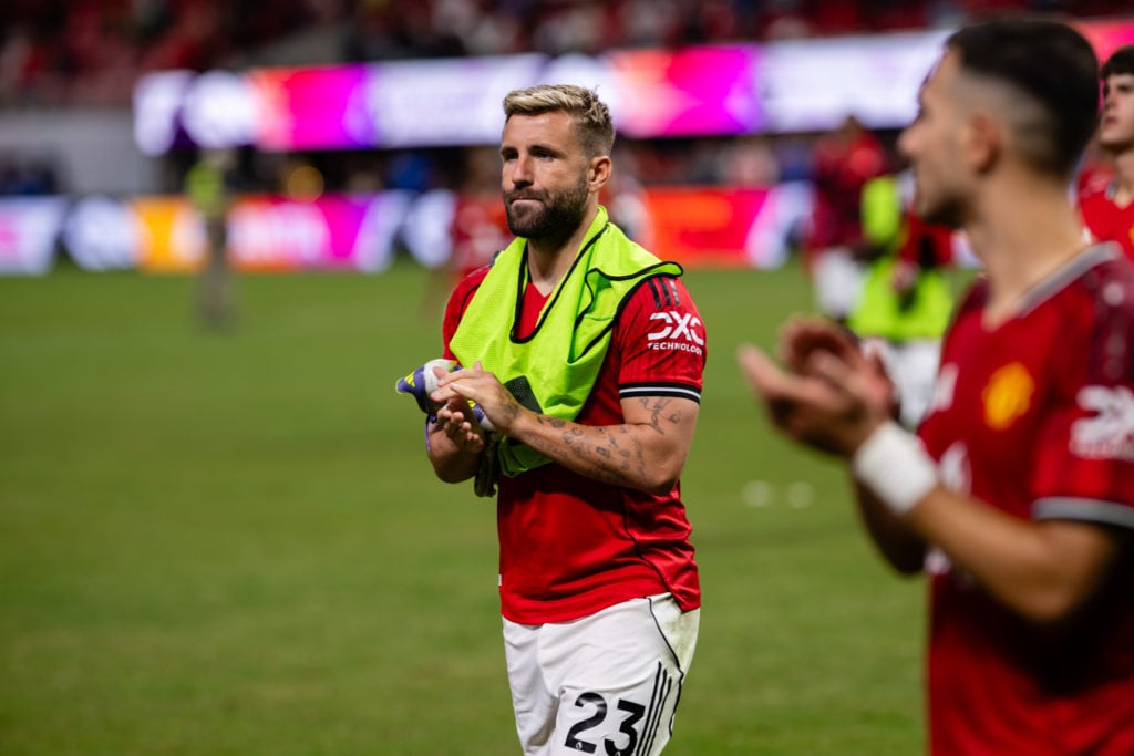 Luke Shaw at end of game with bib around his shoulders