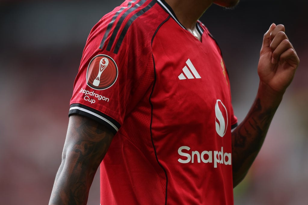 Manchester United Snapdragon sponsorship on shirt sleeve of an anonymous player