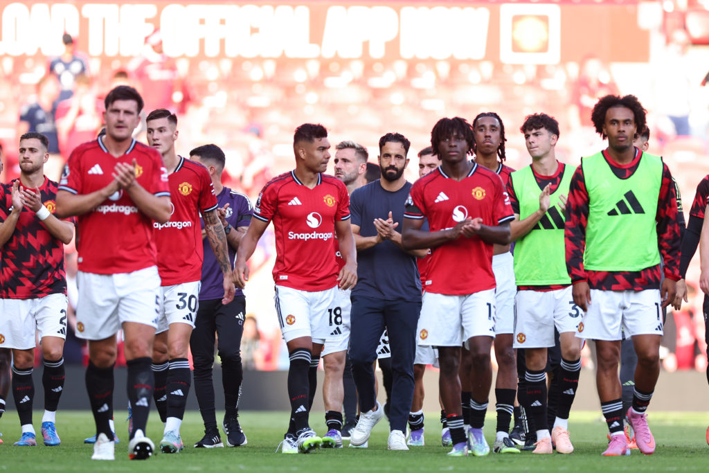 Manchester United manager Ruben Amorim applauds at full-time with his players after the Premier League match between Manchester United and Arsenal at Old Trafford in 2025 in Manchester, England.
