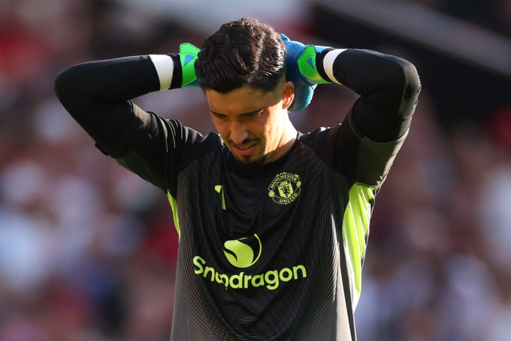 Altay Bayindir grimaces with head in his hands
