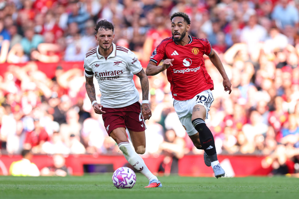 Manchester United forward Matheus Cunha dribbles past Arsenal's Ben White.
