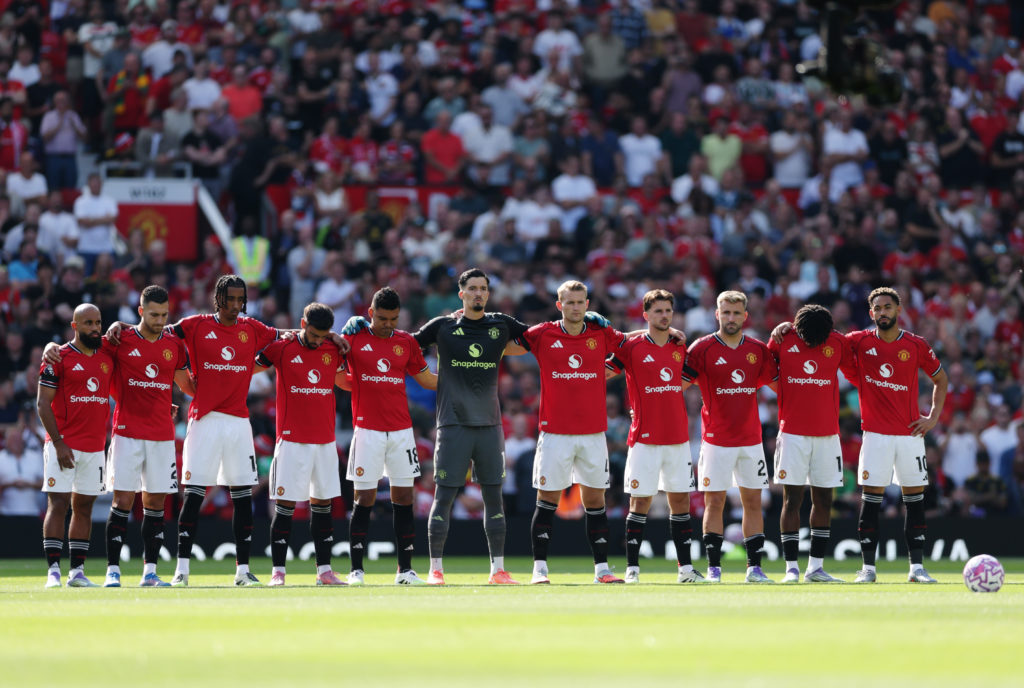 Manchester United players take part in a minute's silence in the memory of Diogo Jota and his brother Andre Silva prior to the Premier League match between Manchester United and Arsenal at Old Trafford in 2025 in Manchester, England.