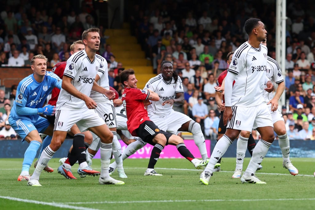 Calvin Bassey fouls Mason Mount, resulting in a penalty during the Premier League match between Fulham and Manchester United at Craven Cottage in 2025 in London, England.