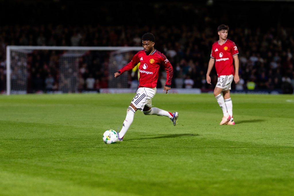 Amad Diallo dribbling with the ball for Manchester United vs Grimsby.