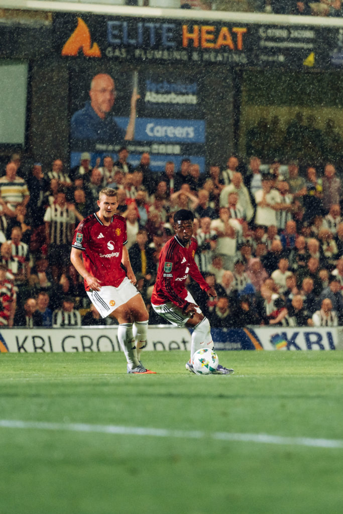Matthijs de Ligt, Amad of Manchester United in action during the Carabao Cup Second Round match between Grimsby Town and Manchester United at Blundell Park on August 27, 2025