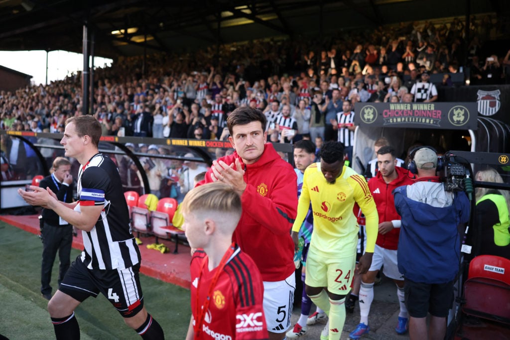 Harry Maguire takes to the field prior to the Carabao Cup match between Grimsby Town and Manchester United at Blundell Park in 2025 in Grimsby, England.