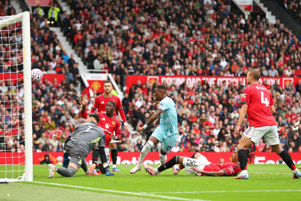 Jaidon Anthony of Burnley scores his team's second goal past Altay Bayindir of Manchester United during the Premier League match between Manchester United and Burnley at Old Trafford on August 30, 2025