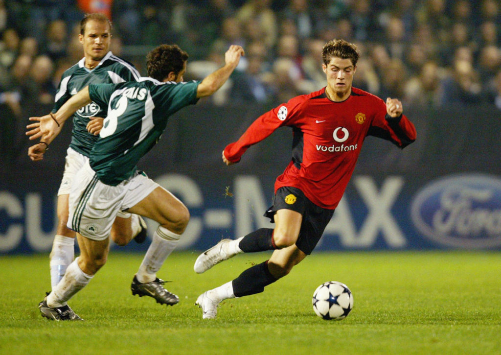 Ioannis Goumas of Panathinaikos chases Cristiano Ronaldo of Manchester United in 2003.