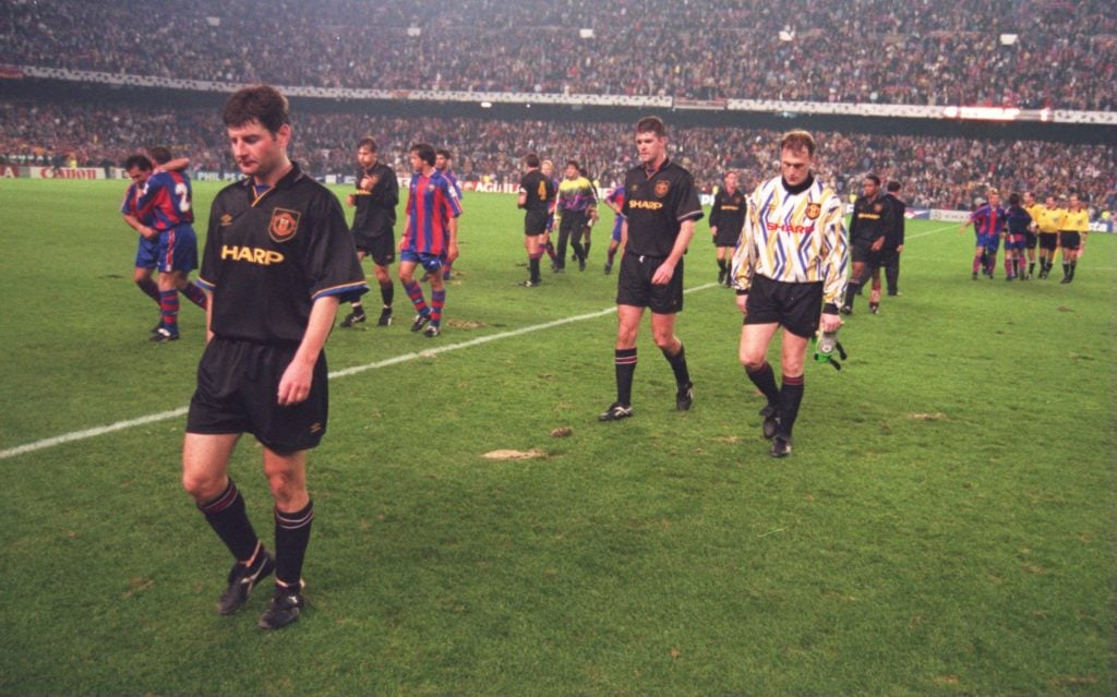 Denis Irwin walks off the pitch for Man Utd away at Barcelona