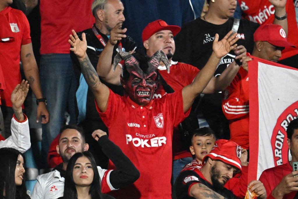 America de Cali fans, with supporter dressed up as Red Devil