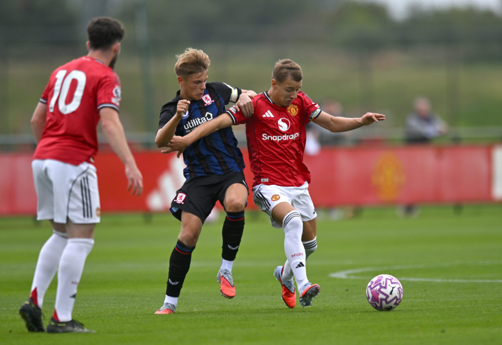 Manchester United's Amir Ibragimov and Middlesbrough's Isaac Greenup compete for possession
