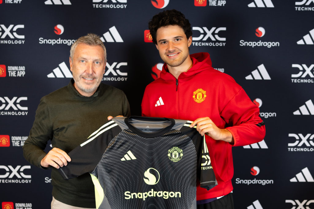 Senne Lammens of Manchester United poses with Director of Football Jason Wilcox after signing for the club at Carrington Training Ground on September 01, 2025