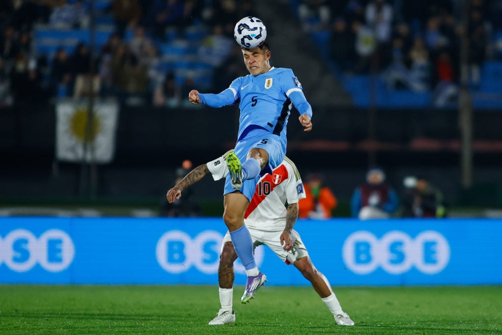 Manuel Ugarte jumps to win a header for Uruguay vs Peru