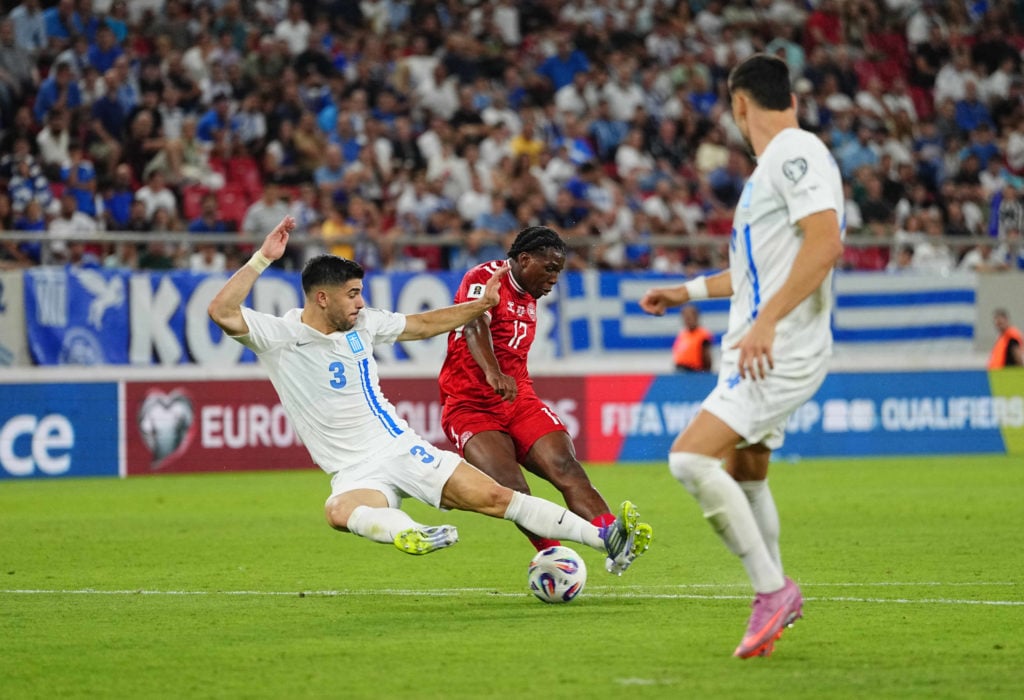 Patrick Dorgu of Denmark and Konstantinos Koulierakis of Greece battle for the ball