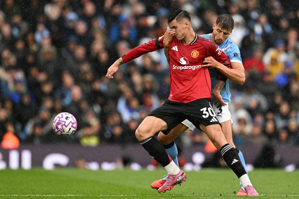 Benjamin Sesko is held back by Ruben Dias