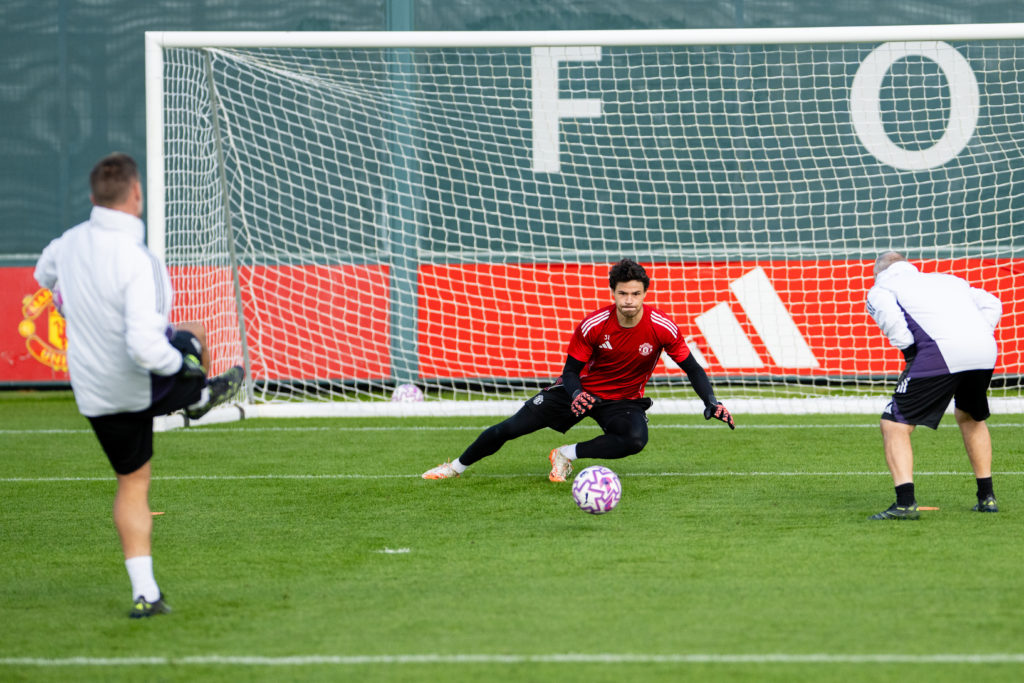 Senne Lammens makes save during Manchester United training.