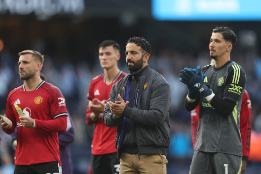 Ruben Amorim applauds Manchester United fans at the Etihad.