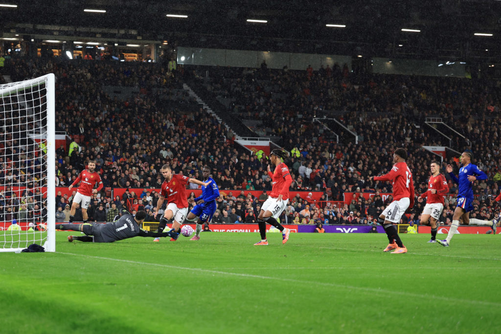 Altay Bayindir makes a save in injury time during the Premier League match between Manchester United and Chelsea at Old Trafford in 2025 in Manchester, England.