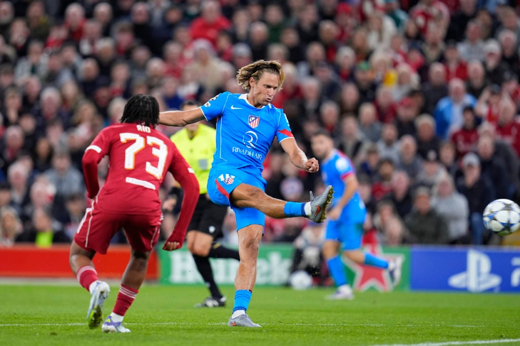 Marcos Llorente shoots for Atletico Madrid vs Liverpool