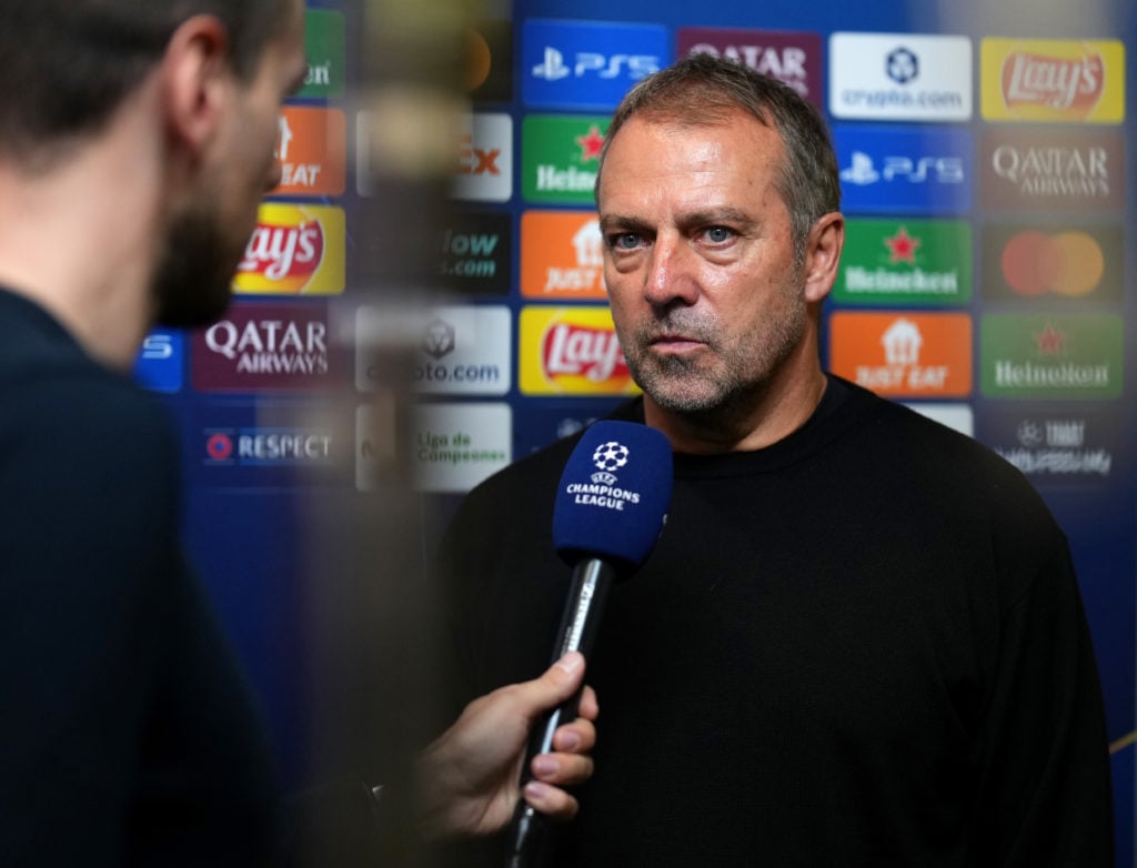 Hansi Flick speaks to the media following the team’s defeat in the Champions League match between Barcelona and Paris Saint-Germain at the Lluis Companys Olympic Stadium in 2025 in Barcelona, Spain.