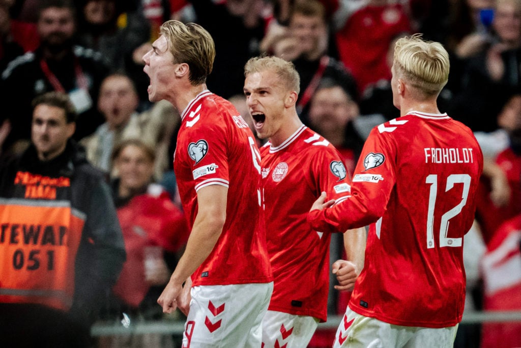 Denmark's forward #09 Rasmus Hoejlund (L) celebrates after scoring his team's opening goal during the FIFA World Cup 2026 Group C European qualification football match between Denmark and Greece at the Parken Stadium in Copenhagen on October 12, 2025
