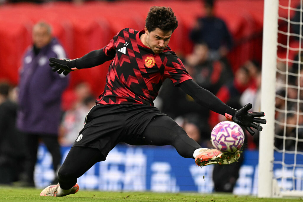 Senne Lammens warming up at Old Trafford