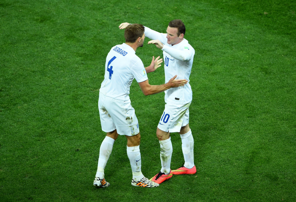 Steven Gerrard and Wayne Rooney playing for England.
