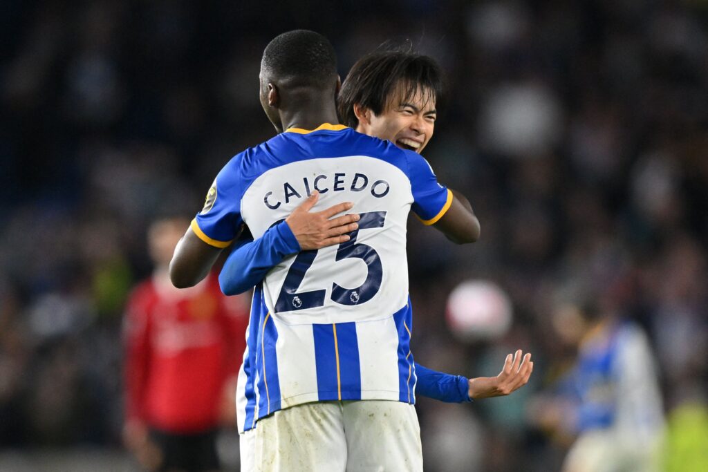Moises Caicedo and Kaoru Mitoma hug for Brighton.