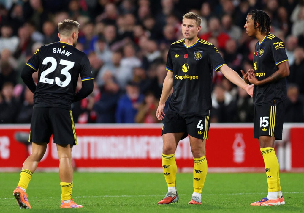 Luke Shaw, Matthijs de Ligt and Leny Yoro of Manchester United interact during the Premier League match between Nottingham Forest and Manchester United at City Ground on November 01, 2025