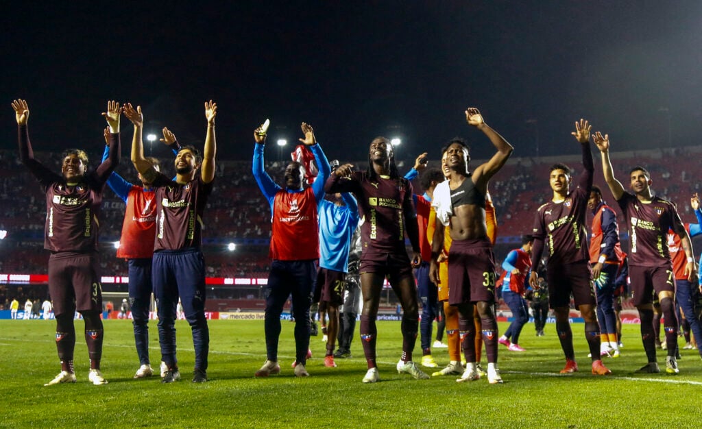 Liga de Quito players celebrate.