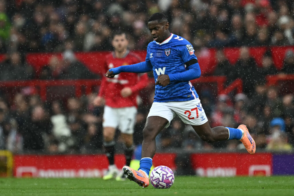 Noah Sadiki playing at Old Trafford