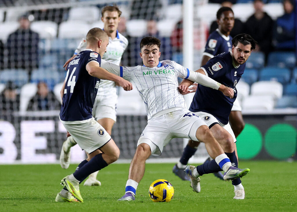 Harry Amass of Sheffield Wednesday is challenged by Casper De Norre of Millwall (left) and Tristan Crama of Millwall (right) during the Sky Bet Championship match between Millwall and Sheffield Wednesday at The Den on November 26, 2025