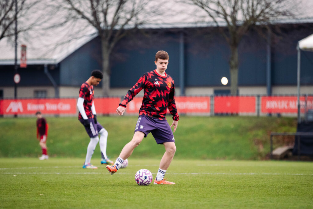 Rafe McCormack on the ball for Manchester United in warm up.