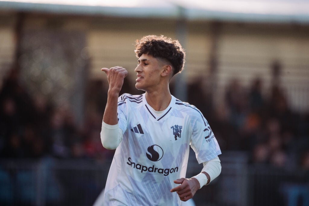 JJ Gabriel celebrates, in Man Utd white kit