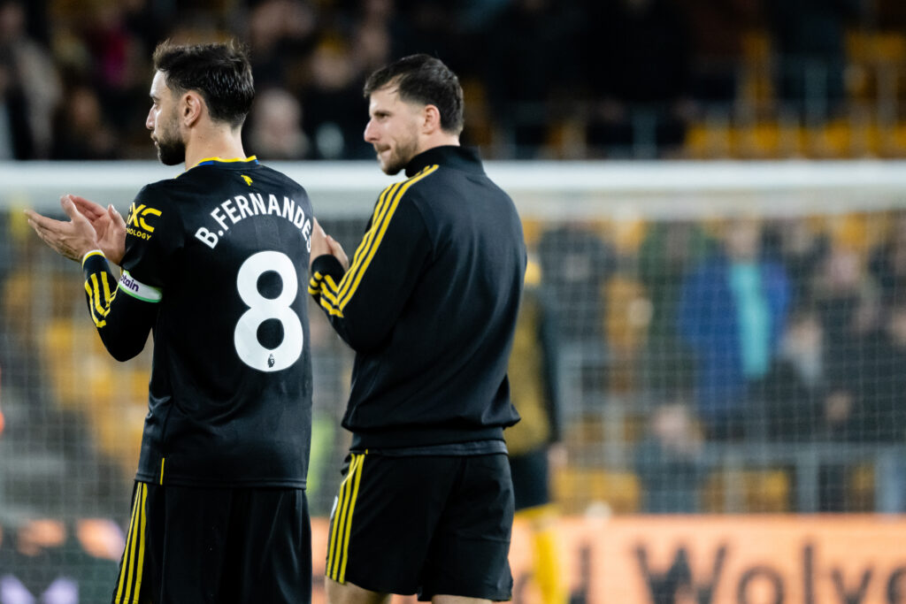 Bruno Fernandes & Mason Mount of Manchester United applaud the fans at the end of the Premier League match between Wolverhampton Wanderers and Manchester United at Molineux on December 8, 2025