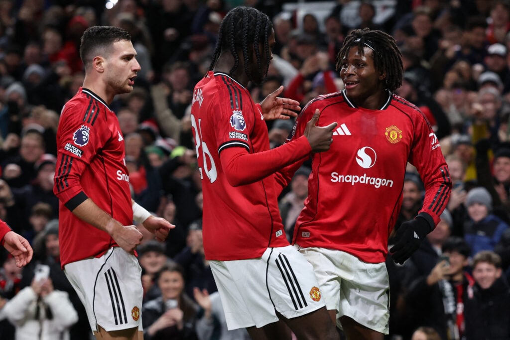 Manchester United players Patrick Dorgu and Ayden Heaven celebrate.