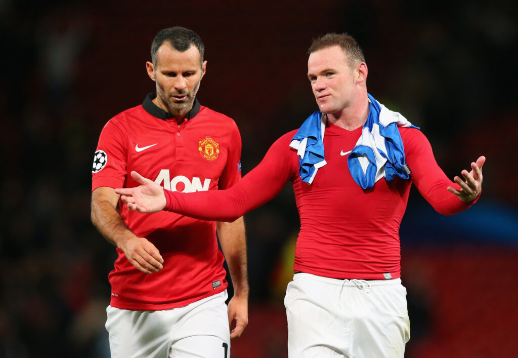 Wayne Rooney speaks to Ryan Giggs at the end of the Champions League Group A match between Manchester United and Real Sociedad at Old Trafford in 2013 in Manchester, England.