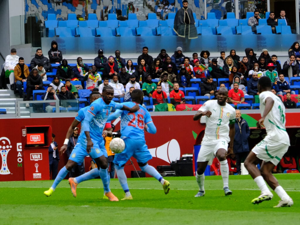 Axel Tuanzebe competes for ball in Congo kit.