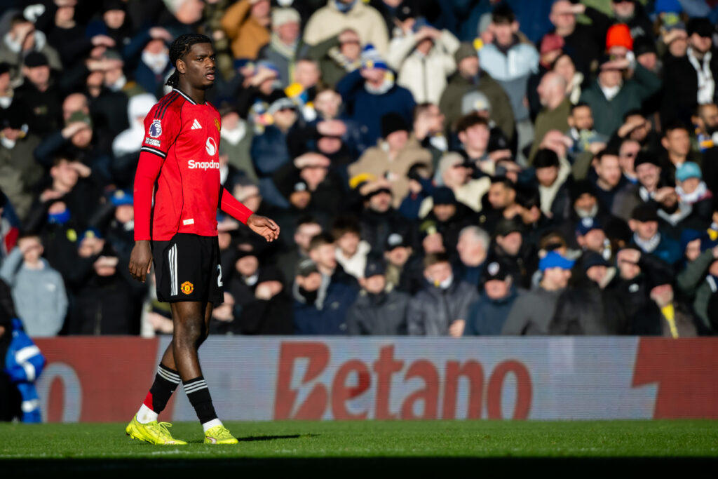 Ayden Heaven at Elland Road, in red Man Utd shirt