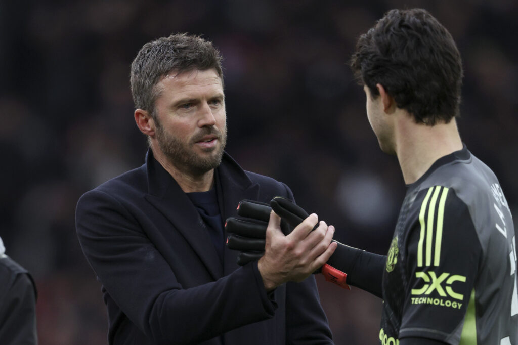 Michael Carrick and Senne Lammens celebrate after the Premier League match between Manchester United and Manchester City at Old Trafford in 2026 in Manchester, England.