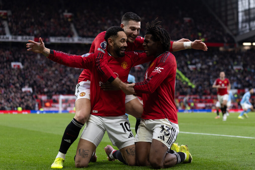 Matheus Cunha and Patrick Dorgu celebrate goal for Manchester United.