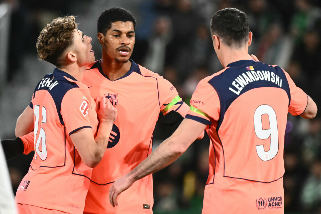 Barcelona's English forward #14 Marcus Rashford (C) celebrates with Barcelona's Spanish midfielder #16 Fermin Lopez and Barcelona's Polish forward #09 Robert Lewandowski after scoring his team's third goal during the Spanish league football match between Elche CF and FC Barcelona at thge Martinez Valero stadium in Elche on January 31, 2026