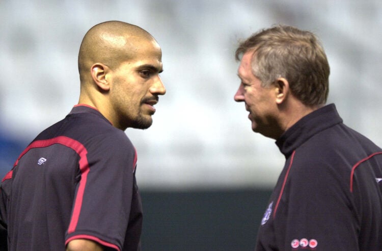 24 Sep 2001:  Juan Sebastian Veron of Manchester United talks with manager Sir Alex Ferguson during training before tomorrows UEFA Champions League...